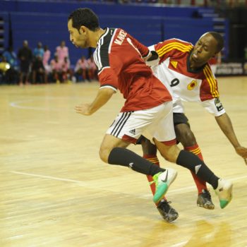 Ibrahim Ibrahim  of Egypt is tackled by Celso Martins  of Angola  during the CAF Futsal Africa Cup of Nations match between Egypt and Angola  on 18 April 2016 at Ellis Park Stadium Pic Sydney Mahlangu/ BackpagePix